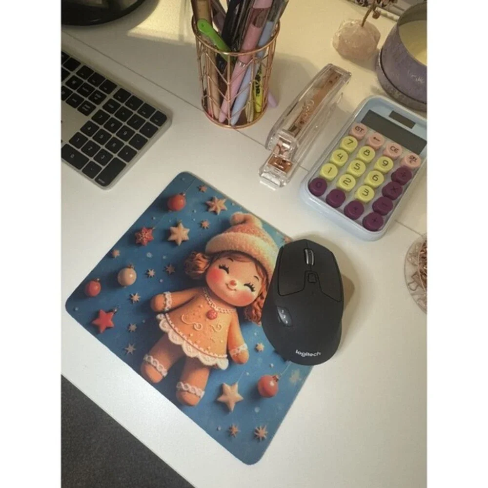 Adorable mouse pad featuring a cute Christmas gingerbread doll design with stars